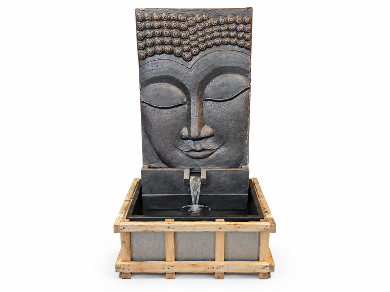 Large dark grey concrete Buddha fountain, carved face above the basin