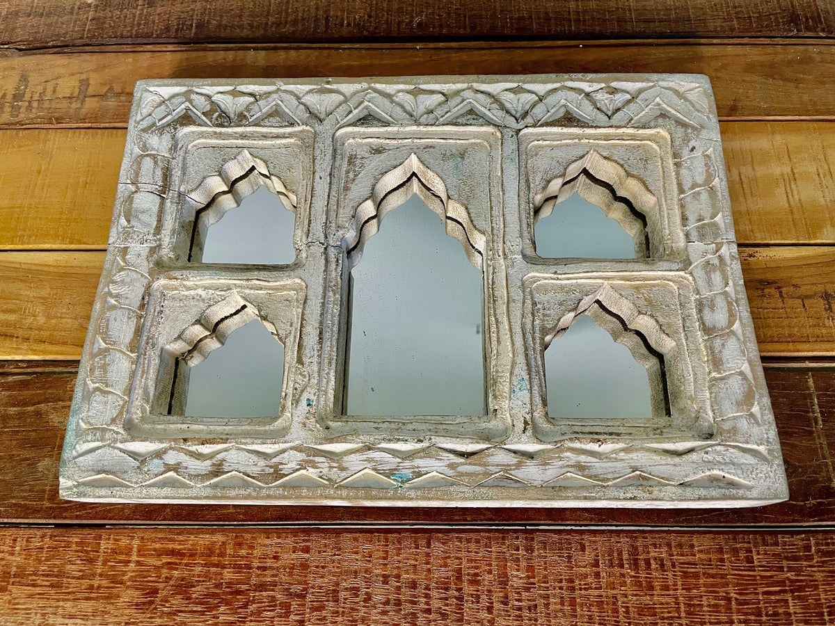 Carved mirror