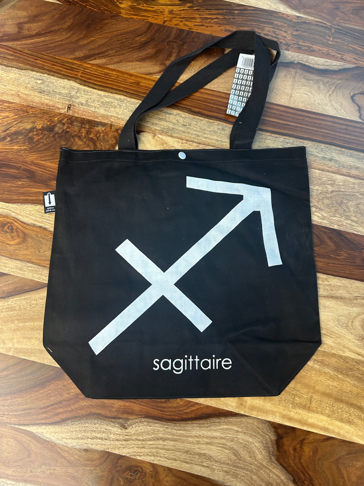 Tote bag noir au symbole du Sagittaire imprimé en blanc
