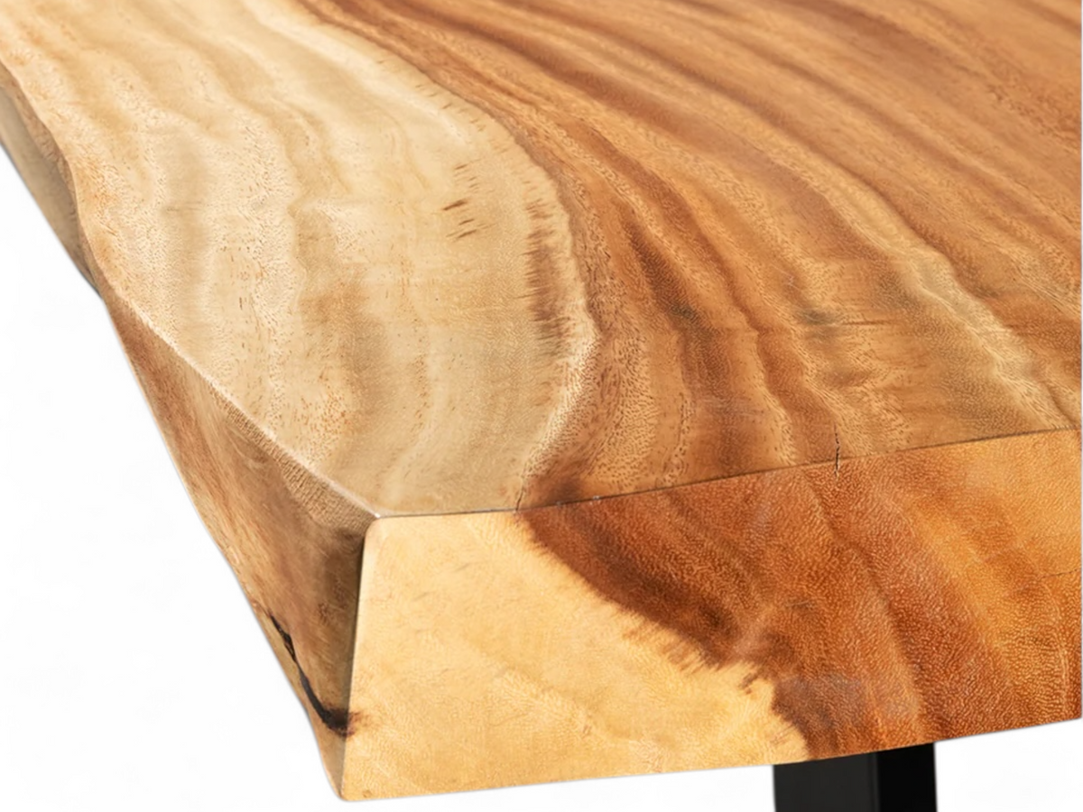 Live edge dining table made of solid Suar wood