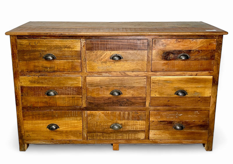Nine-drawer natural reclaimed wood dresser, boards in varied shades and cup pulls